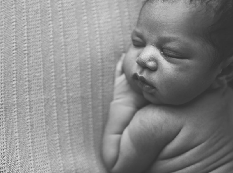 Newborn Photography, black and white of baby on blanket