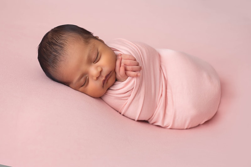 Newborn Photography, baby wrapped in pink blanket