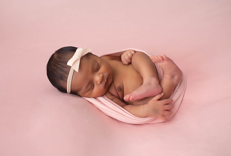 Newborn Photography, baby wrapped in pink