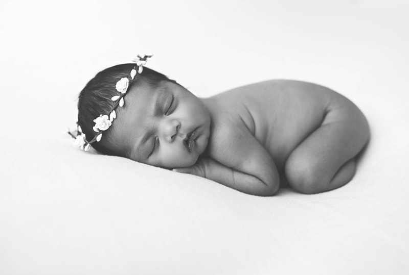Newborn Photography, black and white of baby with white flower crown