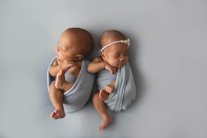 Newborn Photography, twins on a grey background