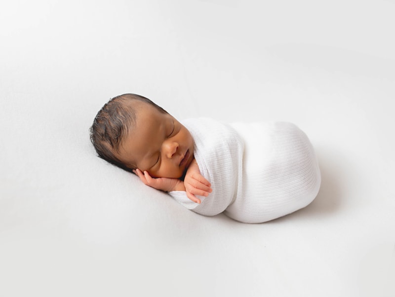Newborn Photography, baby swaddled in white blanket