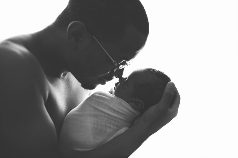 Newborn Photography, black and white image of father and baby