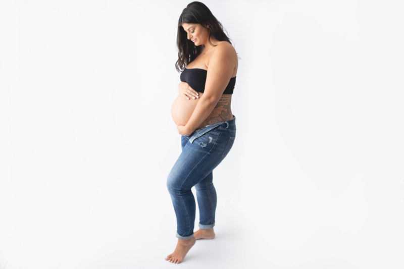 Maternity Photography, mother in jeans with white background