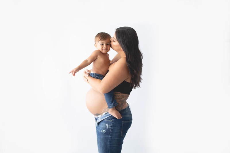 Maternity Photography, mother with little boy with white background