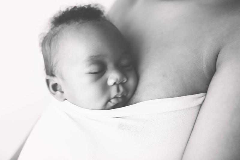Lifestyle Photography, baby wrapped up on mother's chest