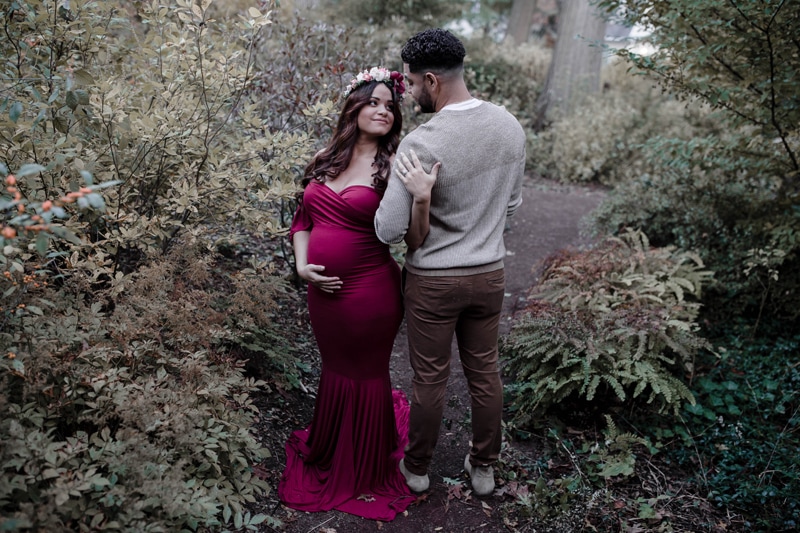 Maternity Photography, man looking at woman with floral crown