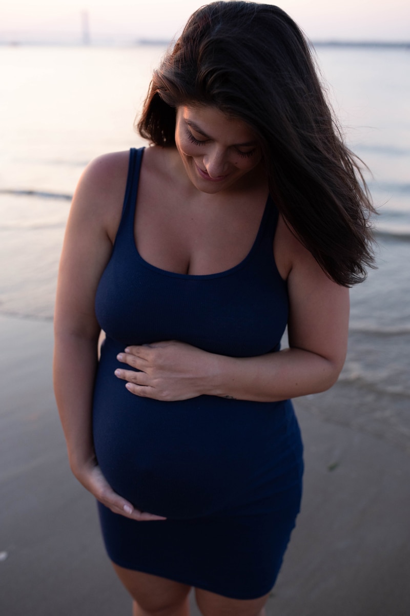 Maternity Photography, woman in blue next to ocean