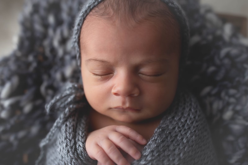 Newborn Photography, close up of baby with grey bonnet