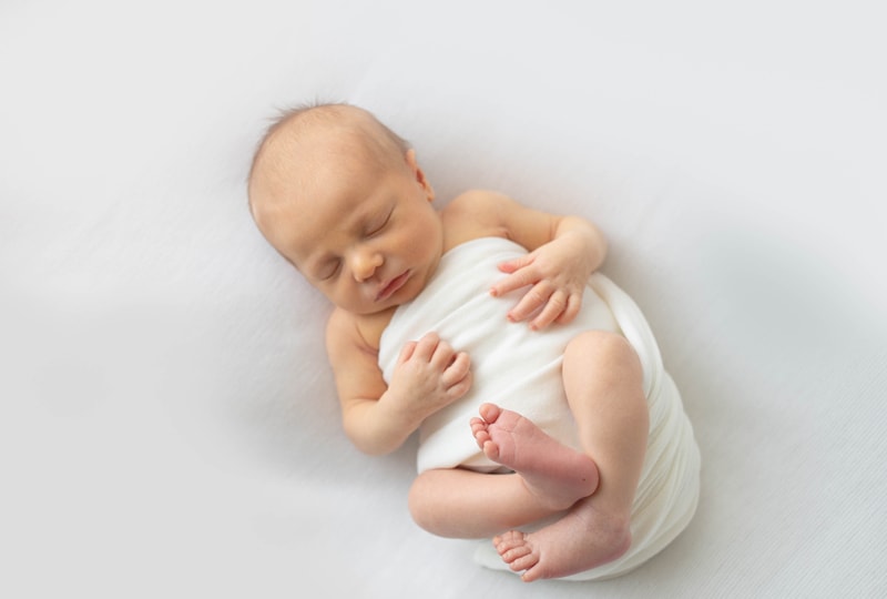 Newborn Photography, baby wrapped in white blanket