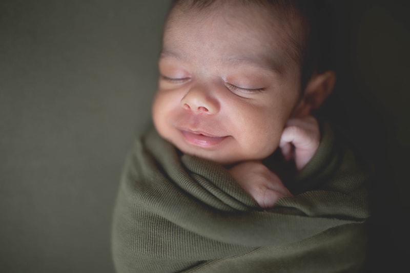 Newborn Photography, baby boy wrapped in green