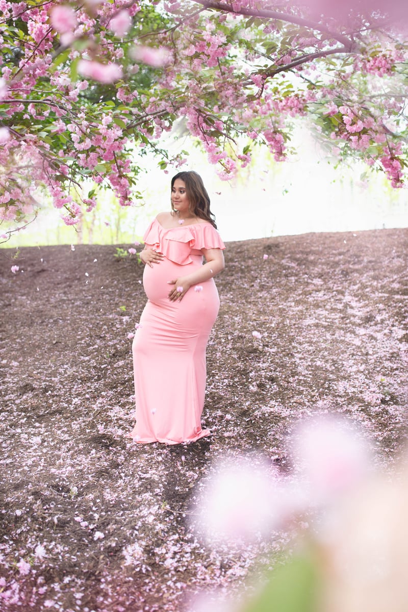 Maternity Photography, woman in pink, under cherry blossom tree